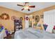 Bright bedroom featuring wood floors, neutral tones, and a ceiling fan at 176 Oak Green Dr, Lawrenceville, GA 30044
