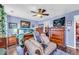 Charming bedroom with wood furniture and decor, featuring a ceiling fan at 176 Oak Green Dr, Lawrenceville, GA 30044