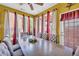 Dining room featuring a large wood table and chairs and a window-lined wall at 176 Oak Green Dr, Lawrenceville, GA 30044