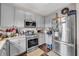 Spacious kitchen with stainless steel appliances and ample cabinet space at 176 Oak Green Dr, Lawrenceville, GA 30044