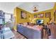 Cozy living room with large sofa, TV, and view into the kitchen at 176 Oak Green Dr, Lawrenceville, GA 30044