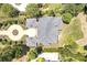 An aerial view showcases the roof, circular driveway, and landscaping of this residential home at 4317 Oglethorpe Nw Loop, Acworth, GA 30101