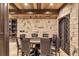 Finished basement featuring a game table, stone accent walls, and a beautifully designed wine cellar at 4317 Oglethorpe Nw Loop, Acworth, GA 30101