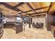 Finished basement with bar, stone accent walls, coffered wood ceiling and dining area for entertaining at 4317 Oglethorpe Nw Loop, Acworth, GA 30101
