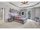 A bedroom featuring grey walls, light colored carpets, and a decorative mural at 4317 Oglethorpe Nw Loop, Acworth, GA 30101