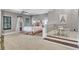 Spacious bedroom featuring neutral walls and carpet, crown molding, and an adjacent seating area at 4317 Oglethorpe Nw Loop, Acworth, GA 30101