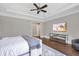 Spacious bedroom with tray ceiling, hardwood floors, and large window offering natural light at 4317 Oglethorpe Nw Loop, Acworth, GA 30101