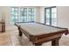 Billiard room with elegant billiard table, decorative fringe, and natural light from the windows at 4317 Oglethorpe Nw Loop, Acworth, GA 30101