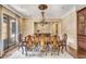 Elegant dining room featuring hardwood floors, a large dining table, and decorative chandelier at 4317 Oglethorpe Nw Loop, Acworth, GA 30101