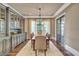 Elegant dining room with hardwood floors, stylish light fixture, and a large window at 4317 Oglethorpe Nw Loop, Acworth, GA 30101