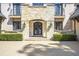 Home with stone entrance features a double door entry, trimmed hedges and manicured landscaping at 4317 Oglethorpe Nw Loop, Acworth, GA 30101