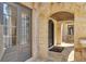 Home's stone arched entryway features glass doors, stone floors and a seating area at 4317 Oglethorpe Nw Loop, Acworth, GA 30101