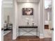 Open hallway with console table and artwork leading to the bedroom and bath at 4317 Oglethorpe Nw Loop, Acworth, GA 30101