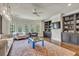 This living room features bay windows, built in bookcases, and dark wood floors at 4317 Oglethorpe Nw Loop, Acworth, GA 30101