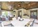 Covered patio with fireplace, grill area, ample seating, and stone flooring for relaxing or entertaining at 4317 Oglethorpe Nw Loop, Acworth, GA 30101