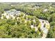 Aerial view of pristine tennis courts in a wooded community, offering an active lifestyle at 4317 Oglethorpe Nw Loop, Acworth, GA 30101