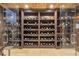 Climate-controlled wine cellar with custom wood shelving and glass door for displaying an extensive collection at 4317 Oglethorpe Nw Loop, Acworth, GA 30101