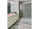 Bathroom featuring a glass enclosed shower, double sink vanity, and tile flooring at 1452 Ridgebend Se Way, Mableton, GA 30126