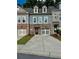Charming townhouse featuring a brick and siding facade, private garage, and well-maintained front lawn at 1452 Ridgebend Se Way, Mableton, GA 30126