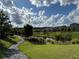 Scenic view of the community pond surrounded by lush greenery and a walking path at 1452 Ridgebend Se Way, Mableton, GA 30126