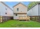 Spacious fenced backyard with a deck and manicured lawn, offering privacy and space at 639 Ira Sw St, Atlanta, GA 30312