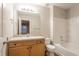 Bright bathroom featuring a single sink vanity, large mirror, and a shower-tub combination at 639 Ira Sw St, Atlanta, GA 30312