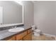 A clean bathroom features a neutral color scheme, classic fixtures, and tile flooring at 639 Ira Sw St, Atlanta, GA 30312