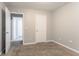 Neutral carpeted bedroom featuring two entryways and modern electrical fittings at 639 Ira Sw St, Atlanta, GA 30312