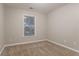 Cozy bedroom with neutral carpet, a window with blinds, and ample natural light at 639 Ira Sw St, Atlanta, GA 30312