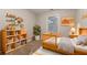 Bedroom with wooden crib, toy shelves, and a cozy atmosphere for restful sleep at 639 Ira Sw St, Atlanta, GA 30312