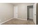Clean bedroom with carpet, white door, and easy access to other rooms in the home at 639 Ira Sw St, Atlanta, GA 30312