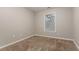 Well-lit bedroom with wall to wall carpet, a window with blinds, and electrical outlets at 639 Ira Sw St, Atlanta, GA 30312
