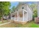 Charming two-story home featuring a welcoming front porch and a vibrant red front door at 639 Ira Sw St, Atlanta, GA 30312
