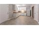 Bright kitchen with white cabinets and appliances offers a functional space, complemented by tile flooring at 639 Ira Sw St, Atlanta, GA 30312
