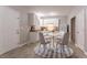 Cozy kitchen with white cabinetry, a dining table for four, and neutral décor at 639 Ira Sw St, Atlanta, GA 30312