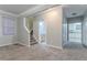 Spacious living area leads to stairs and includes views into the kitchen and bathroom at 639 Ira Sw St, Atlanta, GA 30312
