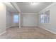 Inviting living room with natural light, neutral paint, and plush carpeting provides a relaxing atmosphere at 639 Ira Sw St, Atlanta, GA 30312