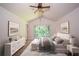 A staged bright bedroom featuring furniture and decor at 7472 Woods Ct, Lithonia, GA 30248