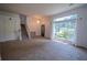 Open entryway featuring staircase, chandelier, and a large window providing plenty of natural light at 7472 Woods Ct, Lithonia, GA 30248