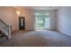 Bright entryway featuring a chandelier and a large window providing plenty of natural light at 7472 Woods Ct, Lithonia, GA 30248