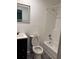 Bright bathroom features a vanity with storage, illuminated mirror, tub with shower and white toilet at 1120 Brandon Hill Way, Jonesboro, GA 30238