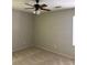 Bedroom features a ceiling fan, light beige walls, and neutral carpet at 1120 Brandon Hill Way, Jonesboro, GA 30238
