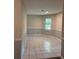 Dining room with neutral paint and base trim and ceramic tile floors at 1120 Brandon Hill Way, Jonesboro, GA 30238