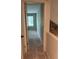 Hallway leading to a bedroom with a window at 1120 Brandon Hill Way, Jonesboro, GA 30238