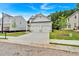 Beautiful two-story home showcasing a well-maintained lawn and modern design at 2703 Jordan Ln, Lithia Springs, GA 30122