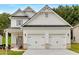 Charming two-story home with a welcoming front porch and a two-car garage at 2703 Jordan Ln, Lithia Springs, GA 30122
