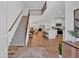 Open-concept interior with a staircase, modern kitchen, and a cozy living area at 2703 Jordan Ln, Lithia Springs, GA 30122