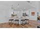 Bright kitchen with a large island, pendant lighting, and stainless steel appliances at 2703 Jordan Ln, Lithia Springs, GA 30122