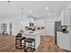 Modern kitchen with a center island, sleek appliances, and adjacent dining area at 2703 Jordan Ln, Lithia Springs, GA 30122