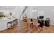 Open living space with hardwood floors, modern lighting and an office work area at 2703 Jordan Ln, Lithia Springs, GA 30122